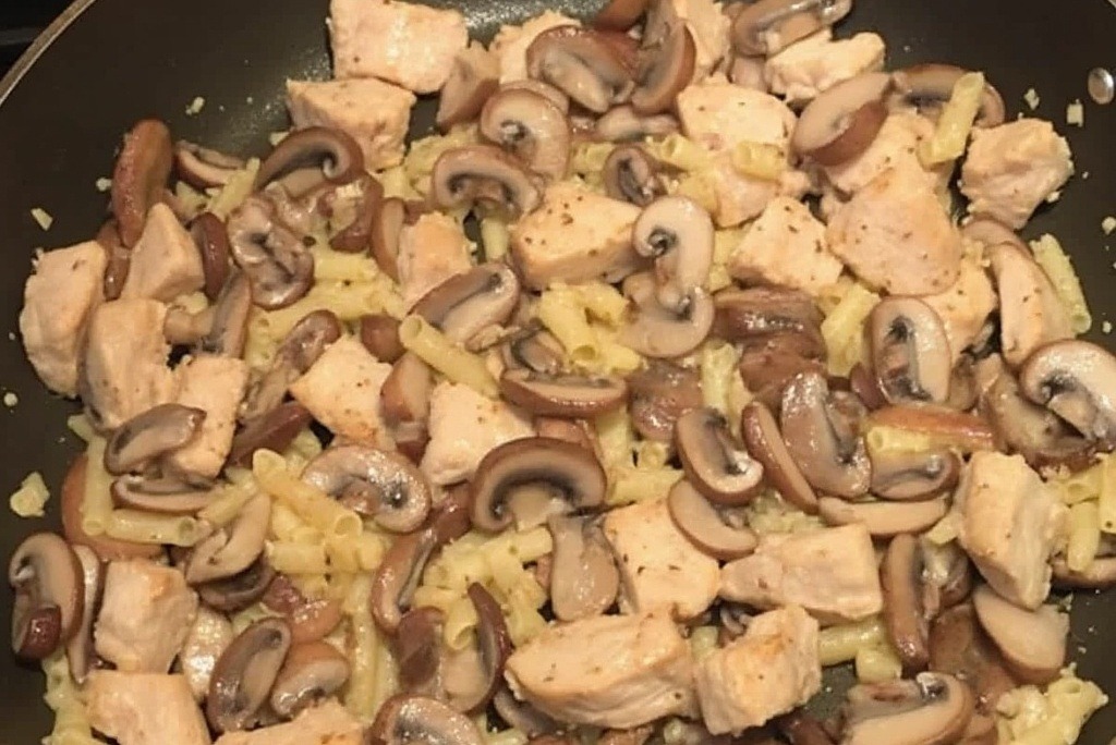 Sautéing chicken and mushrooms